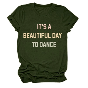 Detail of dark green cotton T-shirt featuring IT'S A BEAUTIFUL DAY TO DANCE slogan print