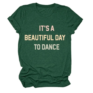 Detail of rolled cuffs and 'IT'S A BEAUTIFUL DAY' letter print on green T-shirt