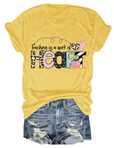Close-up of Teaching is a work of Heart graphic print on yellow cotton t-shirt