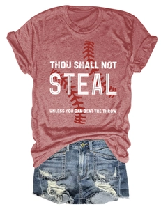 Flat lay of a red baseball graphic tee and distressed denim shorts on white background