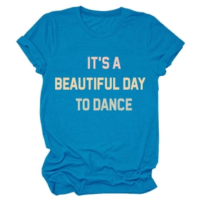 Close-up of blue cotton T-shirt featuring 'IT'S A BEAUTIFUL DAY TO DANCE' print detail