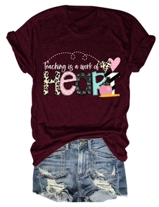 Detail view of teachers heart graphic print on maroon short sleeve cotton t-shirt