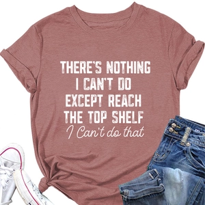 Flat lay of pink cotton T-shirt with white slogan print and rolled sleeve detail
