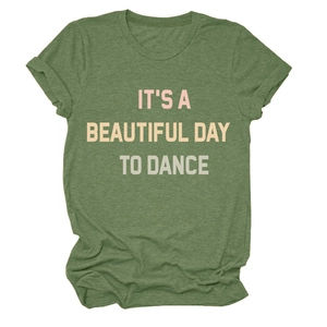 Close-up of moss green t-shirt fabric showing the IT'S A BEAUTIFUL DAY TO DANCE print