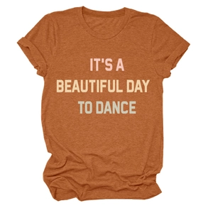 Close-up of rust-colored cotton T-shirt featuring It's a Beautiful Day print