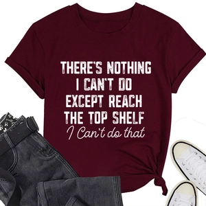 Detail of burgundy t-shirt with funny quote text and casual flat lay styling