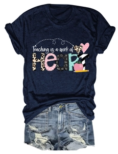 Detail of navy blue T-shirt featuring Teaching is a work of HEART leopard print graphic