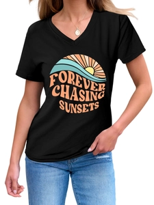 Detail of V-neck black T-shirt with Forever Chasing Sunsets vintage sunset graphic