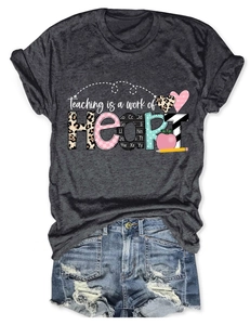 Detail of Teaching is a work of HEART print on grey t-shirt with denim shorts
