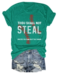 Flat lay of a green crew neck T-shirt with baseball graphic and ripped denim shorts