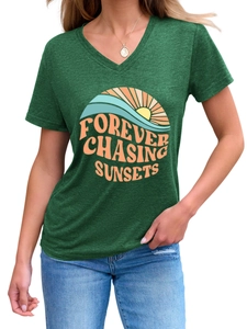 Close-up of V-neck dark green T-shirt with Forever Chasing Sunsets graphic print