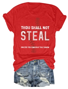 Detail of red crew neck T-shirt with baseball graphic and casual frayed denim shorts