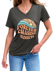 Detail of V-neck dark grey t-shirt with orange Forever Chasing Sunsets graphic print