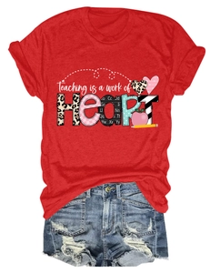 Detail of red Teaching is a work of Heart T-shirt with distressed denim shorts set