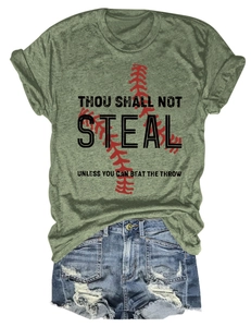 Flat lay of green t-shirt with baseball slogan and distressed denim shorts on white background
