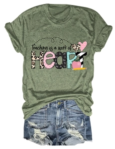 Detail of olive green t-shirt with heart graphic and denim shorts on white background
