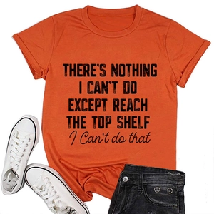 Flat lay of an orange crew neck cotton T-shirt featuring a black graphic slogan print