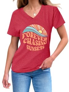 Close-up of red V-neck T-shirt showing retro sunset graphic and textured fabric