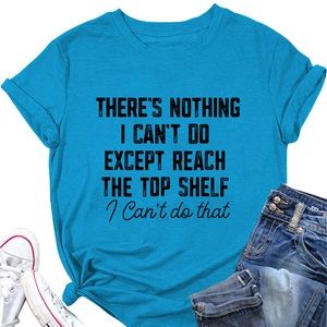 Flat lay of bright blue short sleeve t-shirt with black graphic text and denim shorts