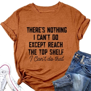 Flat lay of caramel round neck T-shirt with black slogan print and blue jeans