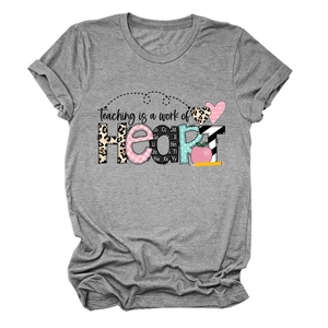 Detail of grey crewneck T-shirt with 'Teaching is a work of HEART' print and apple graphics