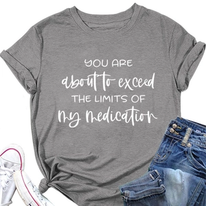 Detail of grey crewneck T-shirt with white quote print and stylish side knot design