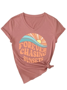 Macro shot of V-neck dusty rose t-shirt with rolled sleeves and a stylish front waist knot
