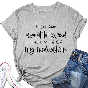 Flat lay of gray T-shirt with 'You are about to exceed' slogan and denim jeans
