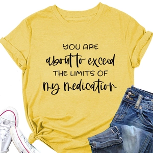 Detail view of cotton yellow T-shirt featuring funny slogan and side-knotted hem design