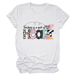 Detail of the heart-themed teaching print on a white cotton crew neck T-shirt