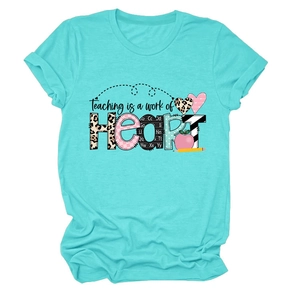 Detail of the 'Teaching is a work of Heart' graphic design on a teal cotton t-shirt