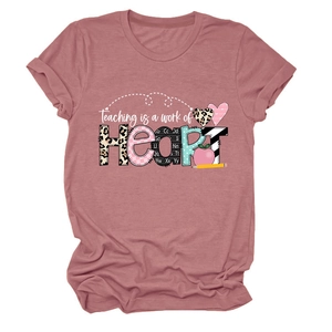 Detail of Teaching is a work of HEART print on dusty rose crew neck t-shirt