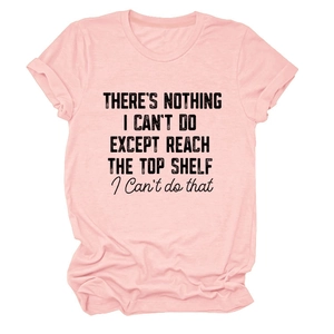 Flat lay of pink cotton T-shirt featuring a bold black artistic slogan on the front