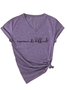 Detail of purple V-neck T-shirt with 'expensive & difficult' text and side knot hem