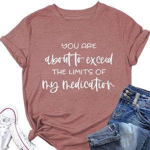 Detail of mauve cotton t-shirt with slogan print and rolled sleeves on white background