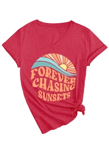 Detail of red V-neck T-shirt with Forever Chasing Sunsets graphic and front hem knot