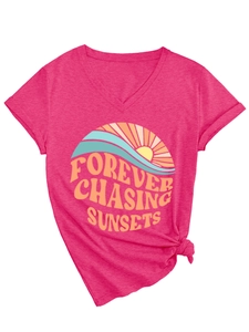 Detail of V-neck T-shirt showing rose pink fabric and Forever Chasing Sunsets graphic