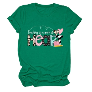 Emerald green crewneck t-shirt featuring Teaching is a Work of Heart graphic on white background