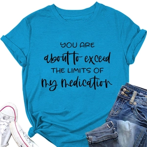 Detail of blue crew neck t-shirt featuring black slogan print and stylish side knot
