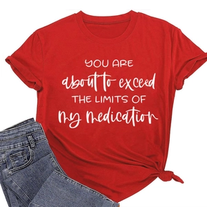 Detail of red crewneck T-shirt with white text print and stylish front knot hem design