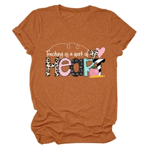 Detail of Teaching is a work of HEART print on a caramel short sleeve t-shirt