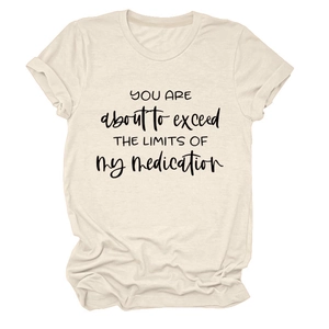 Detail view of beige cotton T-shirt featuring black slogan graphic on soft fabric