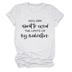 Detail of white cotton T-shirt featuring black slogan print and rolled sleeve design