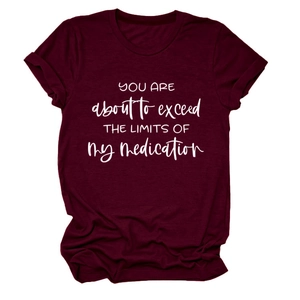 Detail of burgundy cotton crew neck T-shirt with rolled sleeves and quote print