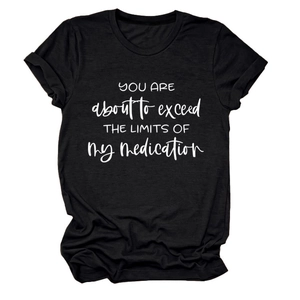 Flat lay of a black crew neck T-shirt featuring white You Are About To Exceed printed text