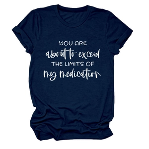 Detail of navy blue crew neck T-shirt featuring white lettering and rolled cuff sleeves
