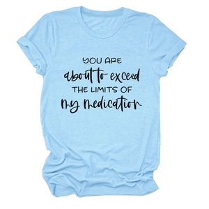 Detail of light blue cotton T-shirt featuring black slogan text on white background