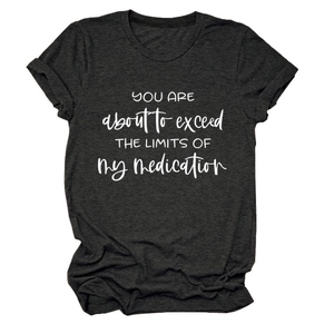 Detail of grey crewneck t-shirt with YOU ARE ABOUT TO EXCEED printed slogan