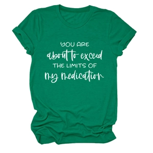 Close-up of the cotton fabric texture and printed slogan on a dark green crewneck T-shirt