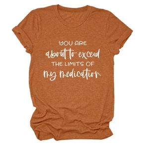 Detail of burnt orange heather tee with You Are About To Exceed printing and rolled sleeves